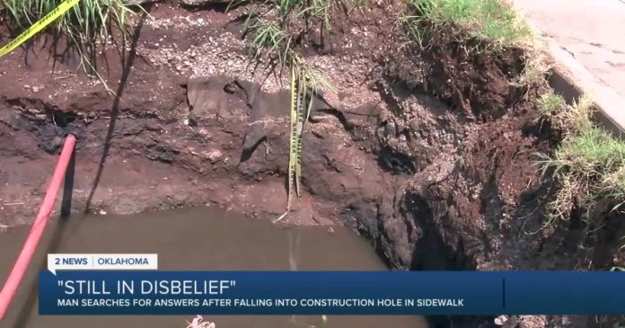 man-rides-bike-into-8-foot-construction-hole