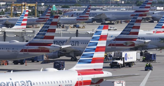american,-united-pare-flights-as-delays-and-cancellations-surge