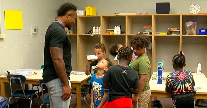 nfl-player-returns-to-childhood-boys-&-girls-club